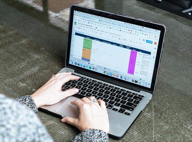 a shot of hands on a laptop